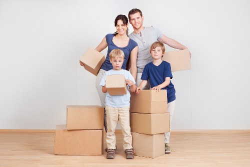 Professional movers handling household furniture during a local move in Ilford