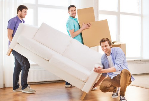 Staff using safety equipment during a moving job