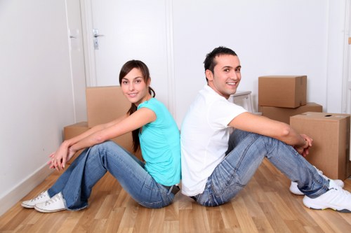 Loading furniture and boxes into a van for an Ilford removal job