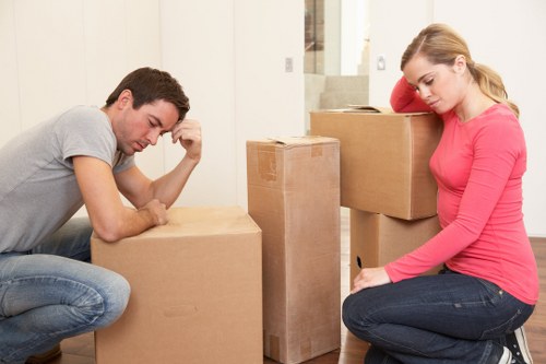 Removal team handling furniture in an Ilford property