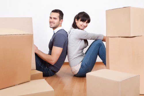 Local moving truck helping with furniture and boxes in Ilford