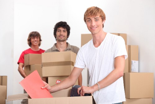 Packed moving boxes and furniture prepared for a home removal in Ilford